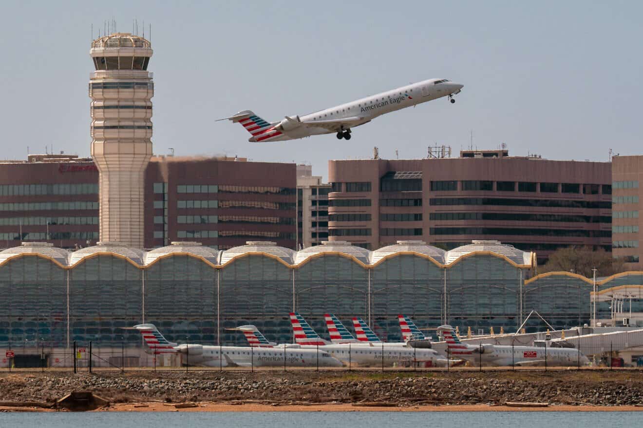 An American Eagle regional jet takes off over the American Airlines terminal at Reagan Washington National Airport in Arlington, Va., on March 23, 2025. Photo by J. David Ake/Getty Images.