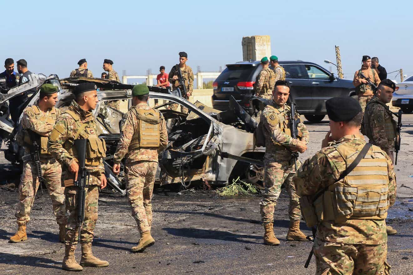 Lebanese soldiers inspect a burnt-out vehicle reportedly hit by an Israeli strike in Ghazieh, near Sidon, April 18, 2025. Photo by Mahmoud Zayyat/AFP via Getty Images.