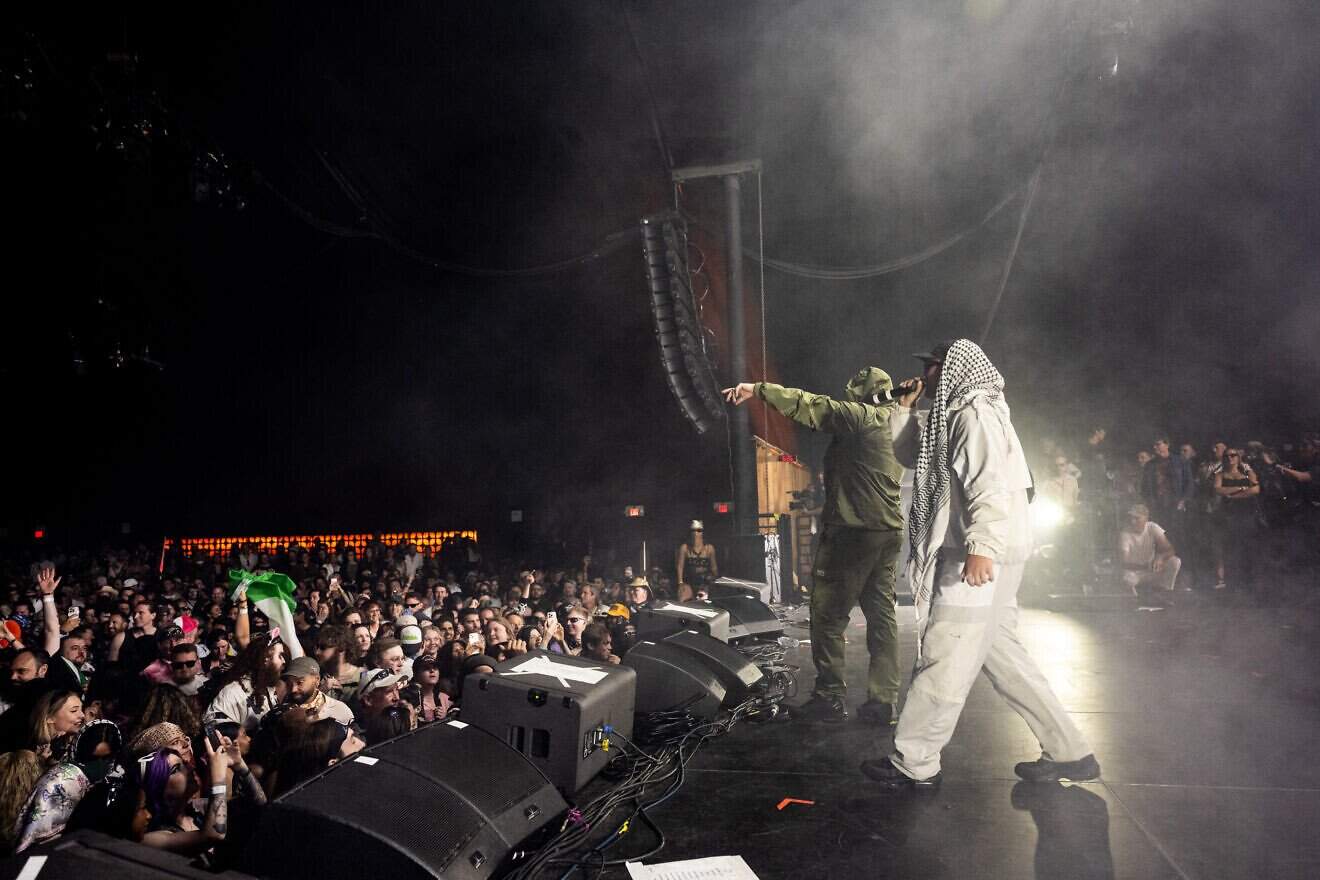 Members of the Kneecap band, including Mo Chara and Moglai Bap, perform during Day 1 of Coachella Valley Music and Arts Festival in Indio, California, on April 18, 2025. Photo by Scott Dudelson/Getty Images for Coachella.