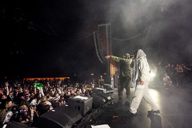 Members of the Kneecap band, including Mo Chara and Moglai Bap, perform during Day 1 of Coachella Valley Music and Arts Festival in Indio, California, on April 18, 2025. Photo by Scott Dudelson/Getty Images for Coachella.