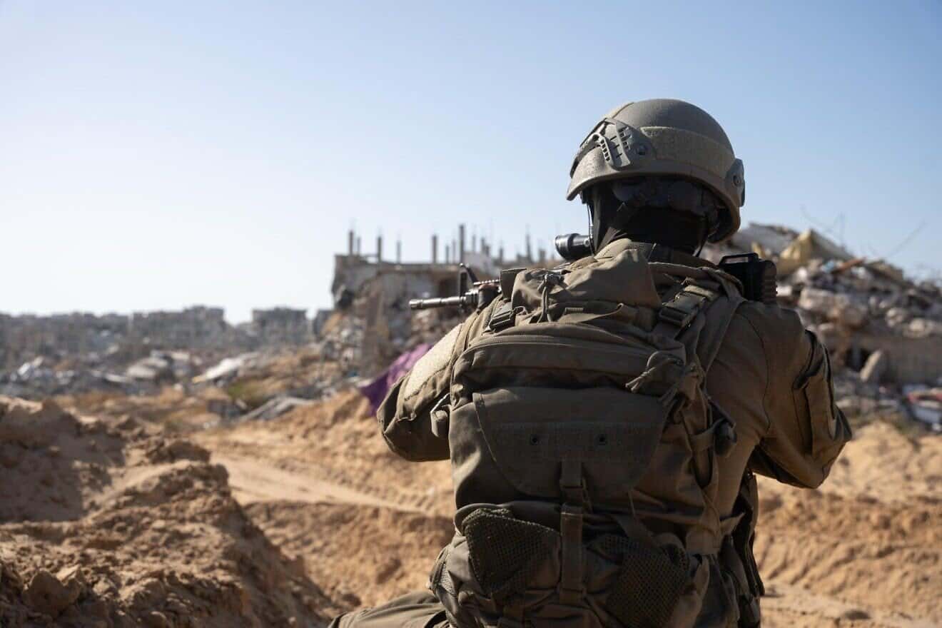 IDF soldier seen in an unknown location in the Gaza Strip, in front of rubble and ruin. Credit: IDF.
