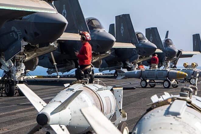 U.S. Navy F-35 fighter jets and precision-guided munitions prepare for operations aboard an aircraft carrier in the Red Sea, April 2025. Source: @CENTCOM/X.