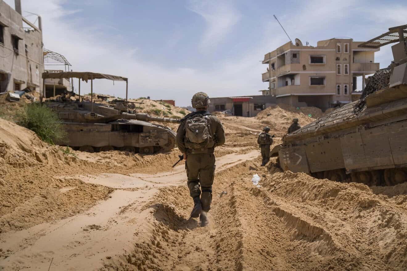 Troops and a tank of the IDF's 401st Brigade in the northern Gaza Strip, on April 4, 2025. Credit: IDF Spokesperson's Unit.