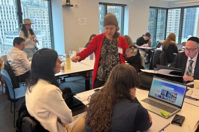 The Jewish Education Project's Rivkah Schack guides participants through the application of AI tools for the teaching of general studies. Photo by Gary Pretsfelder.