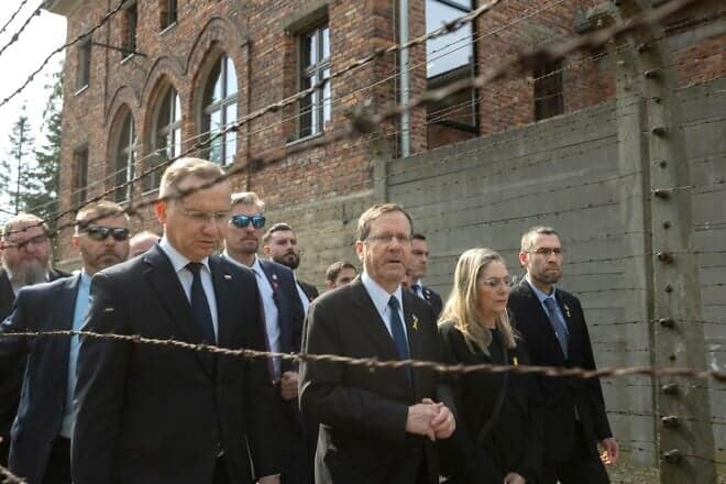 Israeli President Isaac Herzog (center) and Polish President Andrzej Duda (left) led the March of the Living at Auschwitz on April 24, 2025. Credit: Israel's GPO.