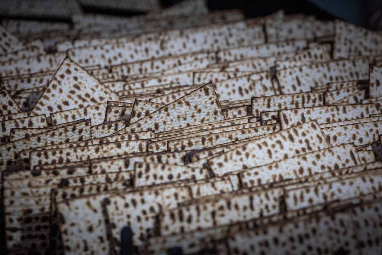 Workers prepare matzah, traditional unleavened bread eaten during the eight-day Jewish holiday of Passover, in "Yehuda Matzos" plant in Jerusalem, April 3, 2025. Photo by Yonatan Sindel/Flash90.