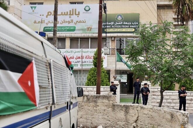 Jordanian police close the entrance of a Muslim Brotherhood headquarter in Amman after the announcement of banning the society in the country on April 23, 2025. Photo by Salah Malkawi/Getty Images.