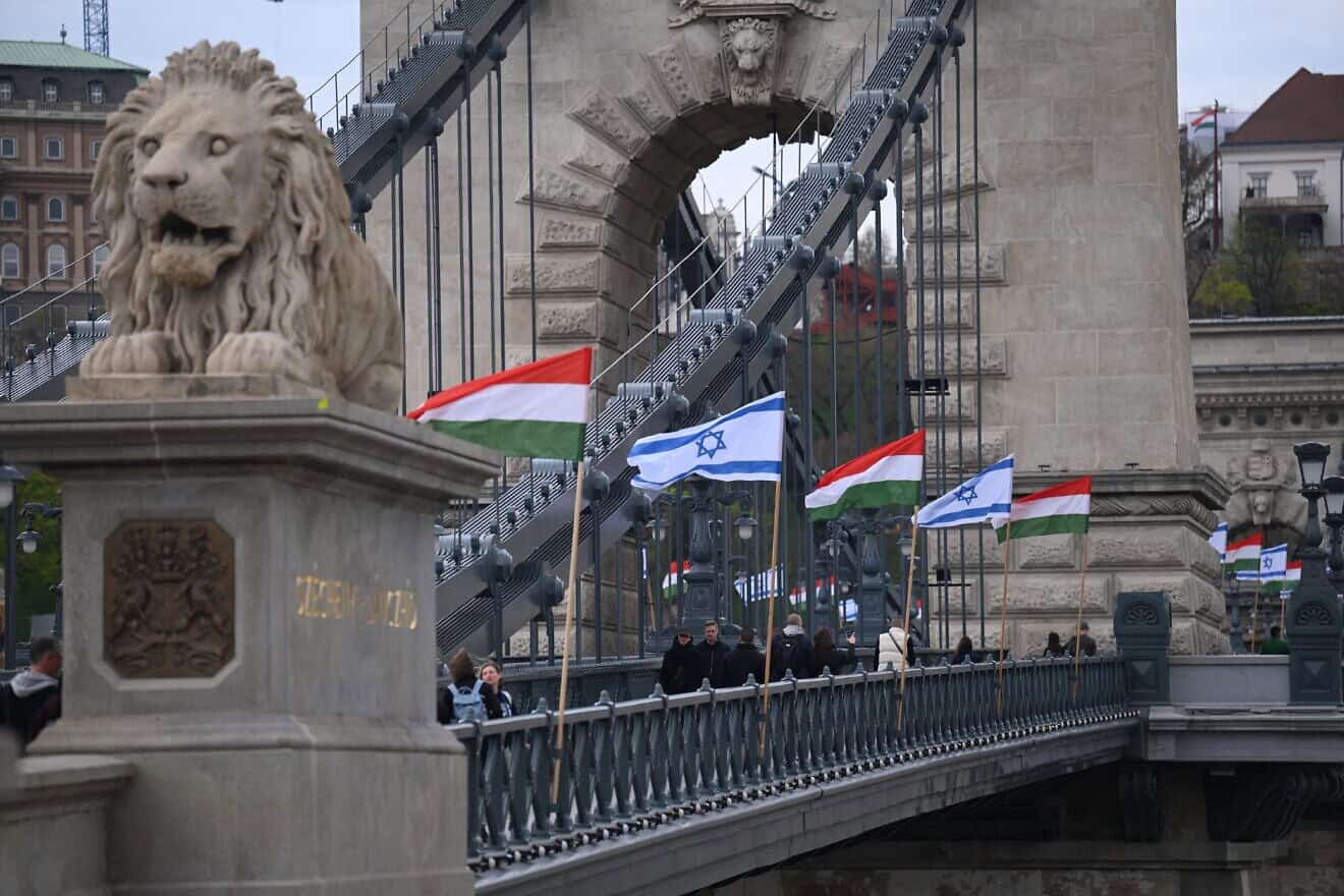 Israeli and Hungarian National flags are raised on the oldest Hungarian bridge, the Széchenyi Chain Bridge in Budapest, as preparations are under way for the visit of Israeli Prime Minister Benjamin Netanyahu, who is scheduled for talks with Hungary's Prime Minister Viktor Orbán and other senior Hungarian officials from April 2 to 6, 2025. Photo by Attila Kisbenedek/AFP via Getty Images.