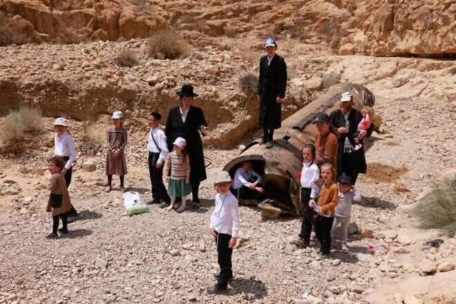 Jews gather around the remains of one of the ballistic missiles Iran fired overnight April 13-14 that landed in an open area near the city of Arad, April 30, 2024. Photo by Menahem Kahana/AFP via Getty Images.