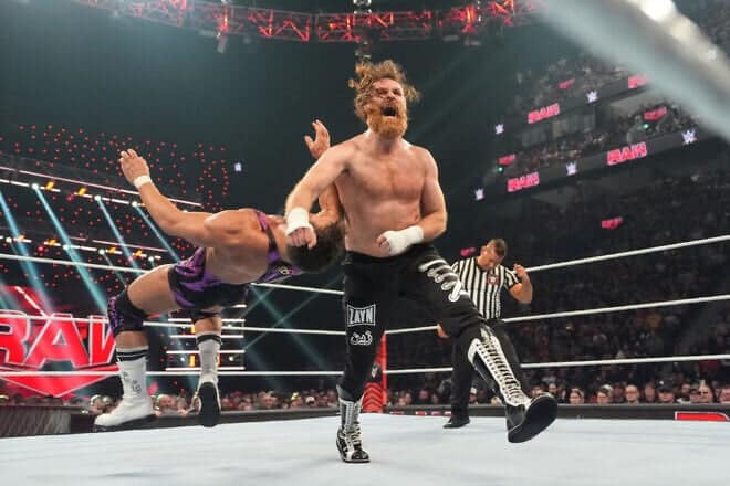 Canadian wrestler Sami Zayn clotheslines Chad Gable during Monday Night RAW at the Bell Centre in Montreal, on April 15, 2024. Photo by WWE via Getty Images.