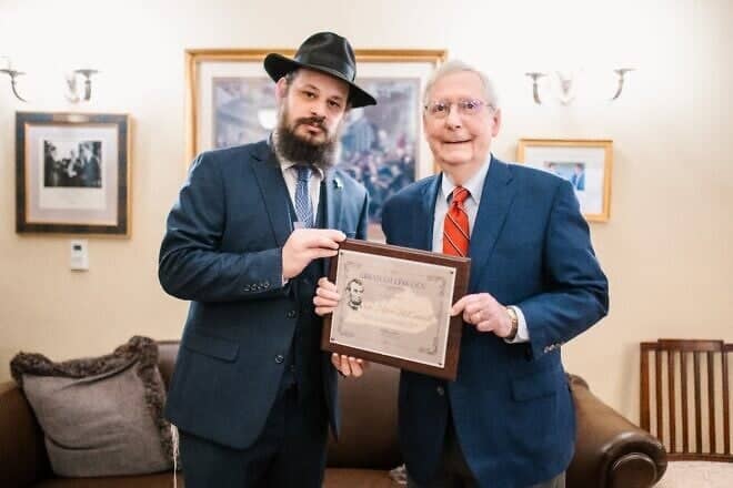 Rabbi Shlomo Litvin, chairman of the Kentucky Jewish Council, presents the Abraham Lincoln Jewish Community Ally Award to Sen. Mitch McConnell during a visit to Washington, D.C., in March 2025. Photo by The Big Picture, @thebigpic.inc.