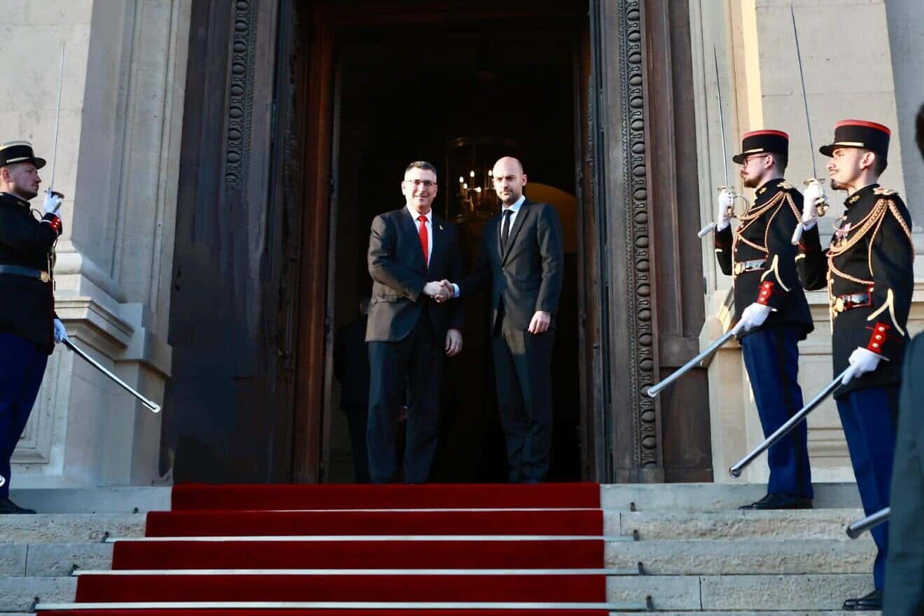 Israel's Foreign Minister Gideon Sa'ar (left) shakes hands with his French counterpart Jean-Noël Barrot on the steps outside the French Foreign Ministry in Paris on April, 3, 2025. (Shalev Man).