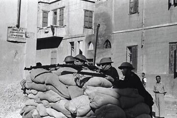 Jewish police officers positioned behind a security post in Tel Aviv, 1947. Credit: Lazar Dinar, KKL-JNF Photo Archive.
