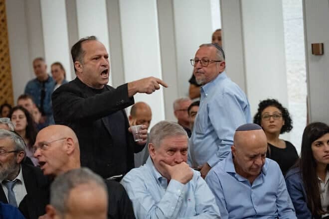 Itzik Buntzel, wearing black, speaks at a court hearing on petitions against the firing of Shin Bet director Ronen Bar at the Supreme Court in Jerusalem, April 8, 2025. Photo by Yonatan Sindel/Flash90.
