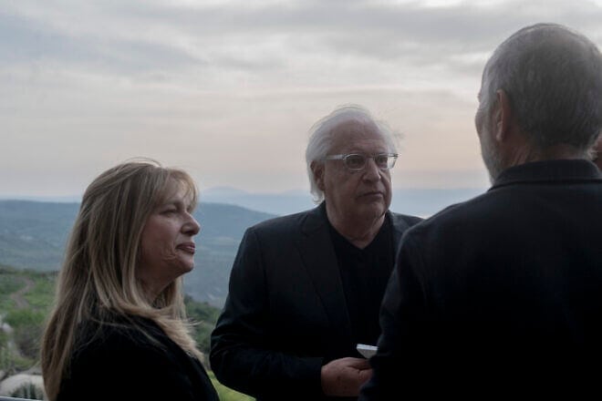 David and Tammy Friedman, facing camera, speak to an attendant of a ceremony held at Ein Kshatot, Israel on March 25, 2025. Photo by Canaan Lidor.