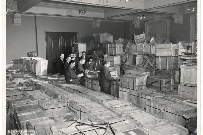 Leaders of the New York-based YIVO Institute for Jewish Research opening crates of salvaged materials. Credit: Courtesy of YIVO.