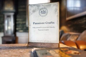 A soot-stained placard advertising Passover crafts for children in the mansion of Pennsylvania Gov. Josh Shapiro in Harrisburg, Pa., on April 13, 2025. Credit: Commonwealth Media Services.