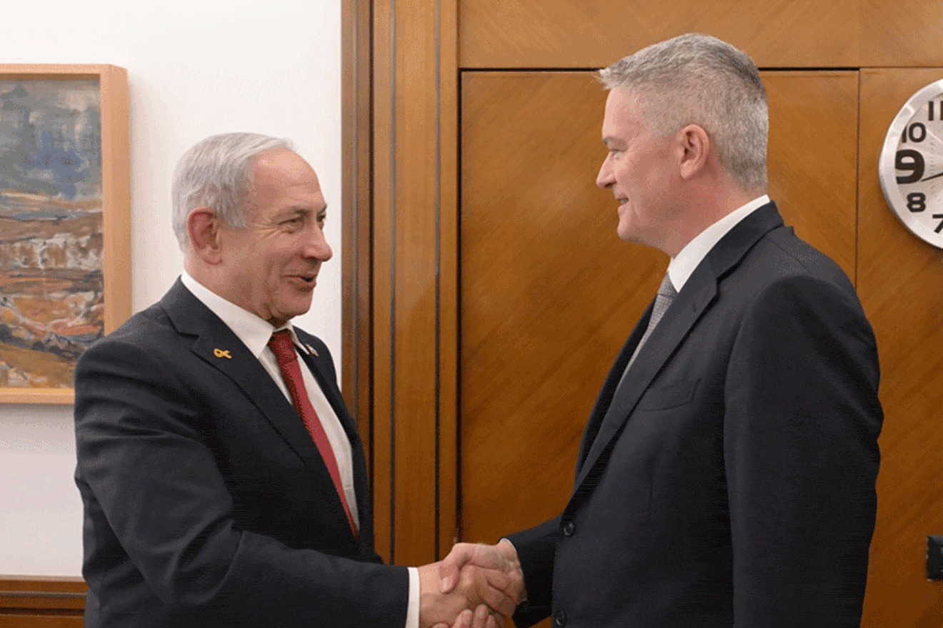 Israeli Prime Minister Benjamin Netanyahu shakes hands with OECD Secretary-General Mathias Cormann during a meeting in Jerusalem on April 1, 2025. Photo by Amos Ben Gershom/GPO.