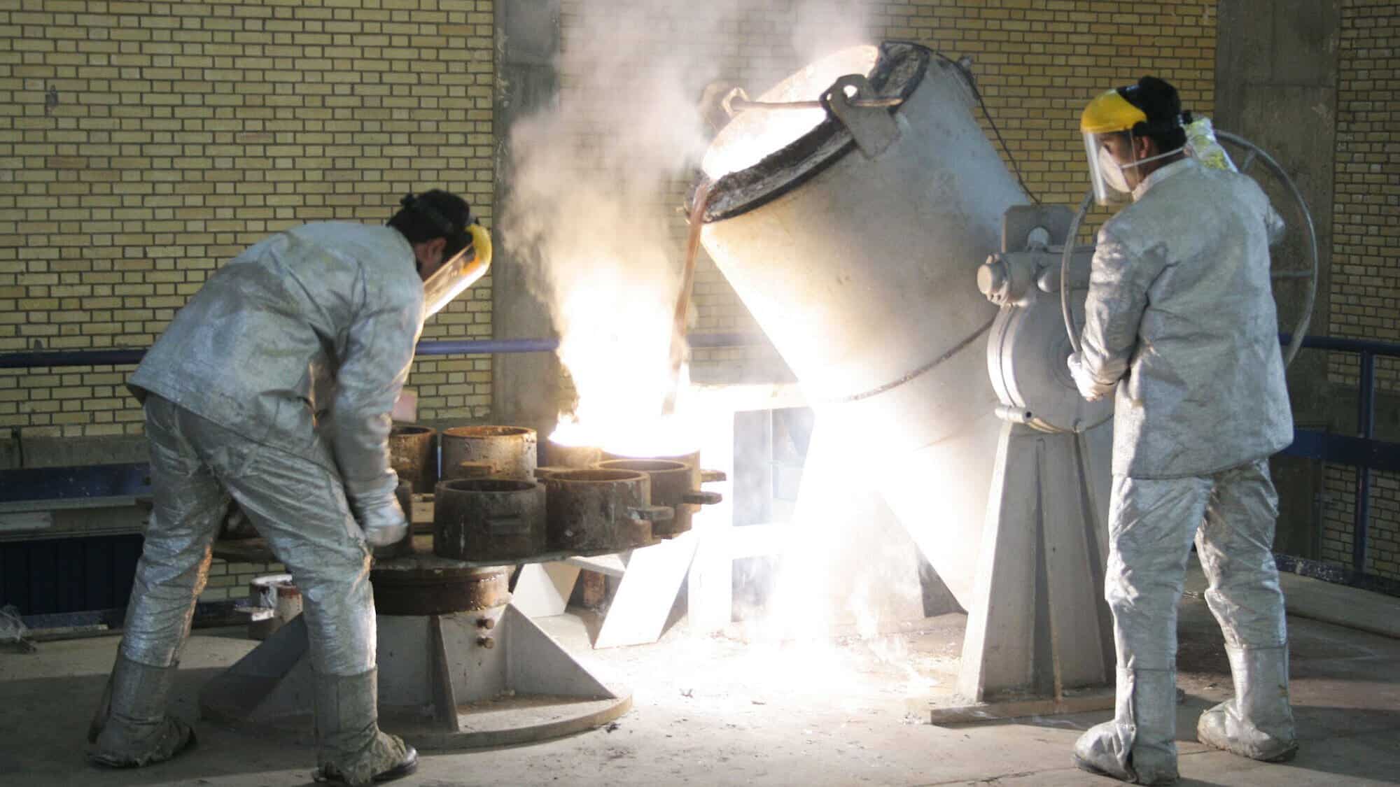 Technicians work inside a uranium conversion facility producing unit just outside Isfahan, Iran, March 30, 2005. Photo by Getty Images.