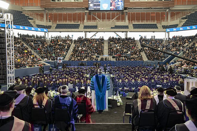 Rabbi Ari Berman, the president of Yeshiva University, speaks at the school's 2025 commencement at Louis Armstrong Stadium, at the Billie Jean King National Tennis Center, in Queens, May 22, 2025. Credit: Yeshiva University.