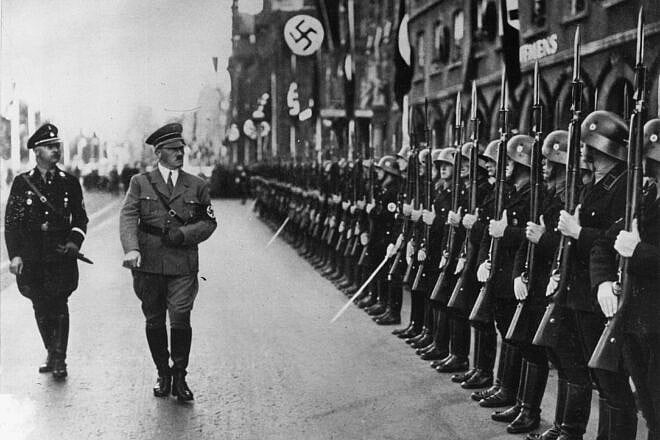 German Chancellor Adolf Hitler and his chief of police Heinrich Himmler inspecting the SS Guard, circa 1938. Photo by Hulton Archive/Getty Images.