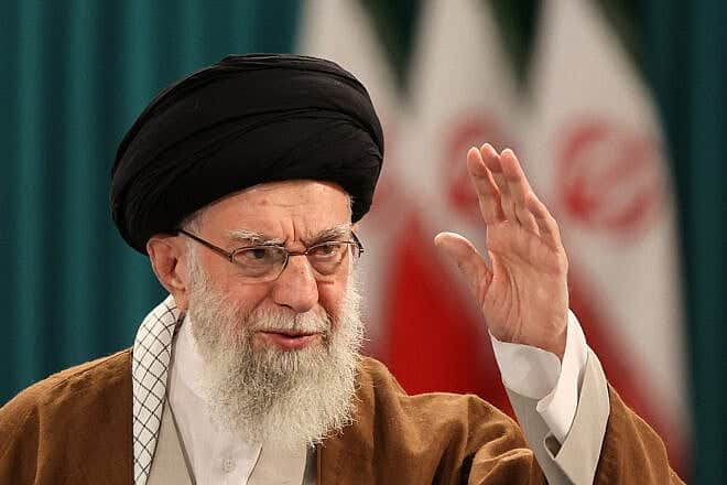 Iranian Supreme Leader Ayatollah Ali Khamenei waves to supporters during a press conference after casting his ballot for the parliamentary runoff elections in Tehran on May 10, 2024. Photo by Atta Kenare/AFP via Getty Images.