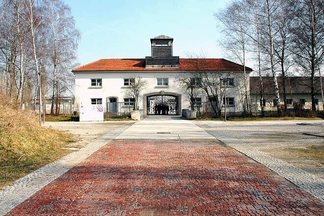 The entrance to the Dachau former concentration camp in Germany. Photo by Guido Radig/Wikimedia Commons