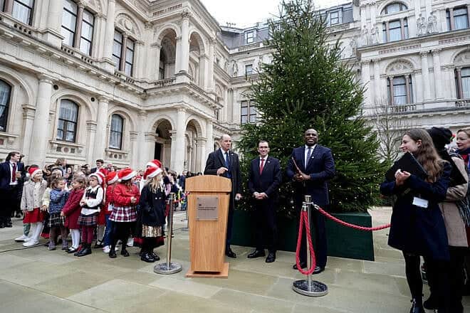 Norwegian Foreign Minister Espen Barth Eide (center) and British Foreign Secretary David Lammy (right) attend a tree lighting ceremony at the British Foreign and Commonwealth Office in London on Dec. 2, 2024. Photo by Aaron Chown—WPA Pool/Getty Images.