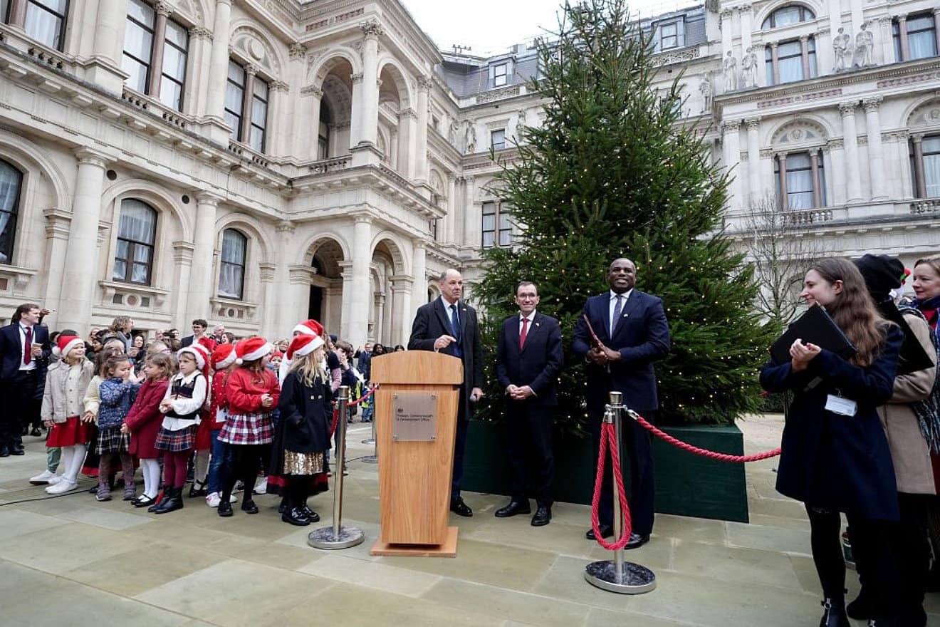 Norwegian Foreign Minister Espen Barth Eide (center) and British Foreign Secretary David Lammy (right) attend a tree lighting ceremony at the British Foreign and Commonwealth Office in London on Dec. 2, 2024. Photo by Aaron Chown—WPA Pool/Getty Images.