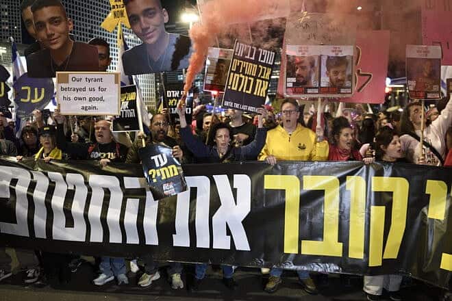 Israelis protest against their government, calling for immediate release of the hostages still being held by Hamas in Gaza, outside the Defense Ministry in Tel Aviv, March 22, 2025. Photo by Gili Yaari/Flash90.