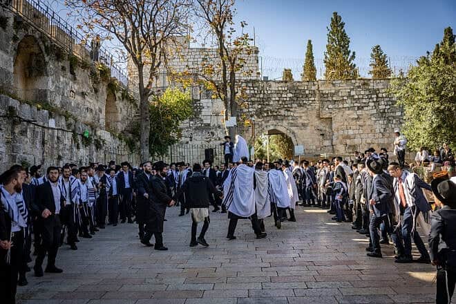 Orthodox Jews pray outside the al-Aqsa compound, also known to Jews as the Temple Mount, during Passover, on April 17, 2025. Photo by Chaim Goldberg/Flash90.