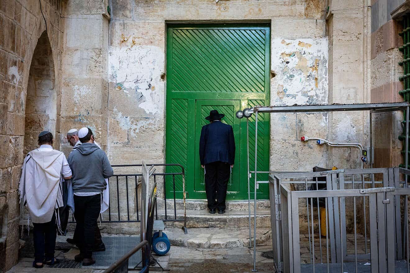 Jews pray at a gate to the Temple Mount in Jerusalem's Old City during Passover, April 17, 2025. Photo by Chaim Goldberg/Flash90.