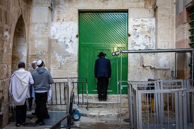 Jews pray at a gate to the Temple Mount in Jerusalem's Old City during Passover, April 17, 2025. Photo by Chaim Goldberg/Flash90.