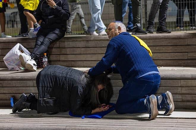 People take cover in Jerusalem as sirens warn of an incoming missile fired from Yemen, May 15, 2025. Photo by Oren Ben Hakoon/Flash90.