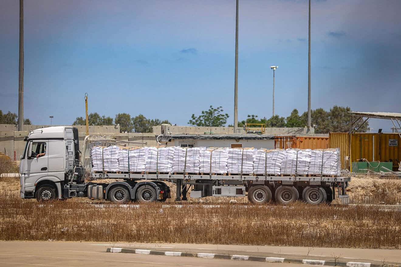 Trucks loaded with humanitarian aid seen before entering the Gaza Strip, on the Israeli side of the border with the Gaza Strip, May 20, 2025. Photo by Flash90.