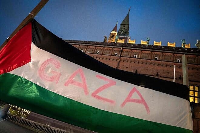 A Palestinian flag with the inscription "Gaza" flutters during a memorial service held on City Hall Square in Copenhagen, on Oct. 27, 2023. Photo by Mads Claus Rasmussen/Ritzau Scanpix/AFP via Getty Images.