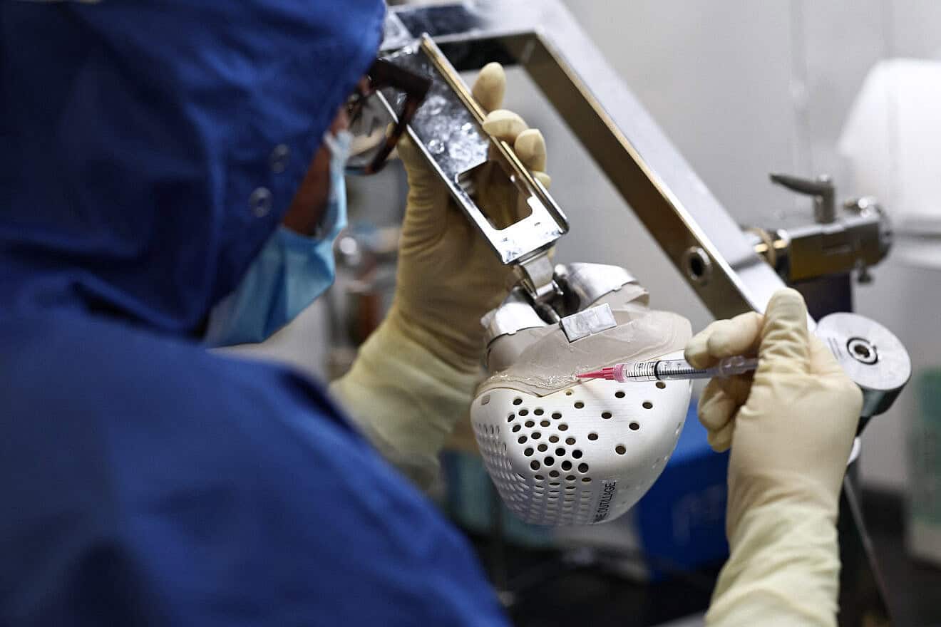 A Carmat employee works on an auto-regulating artificial heart, at the company's headquarters in Bois-d'Arcy, west of Paris, Jan. 16, 2024. Photo by Anne-Christine Poujoulat/AFP via Getty Images.