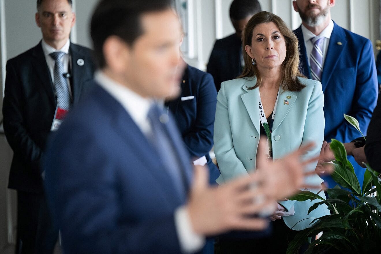 U.S. State Department spokeswoman Tammy Bruce listens as U.S. Secretary of State Marco Rubio speaks with reporters following the G7 foreign ministers meeting in La Malbaie, Quebec, on March 14, 2025. Photo by Saul Loeb/Pool/AFP via Getty Images.