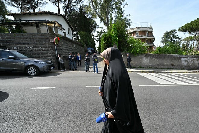 An Iranian state TV channel staffer walks near the Omani embassy in Rome where a second round of nuclear talks are being held between Iran and the United States on April 19, 2025. Photo by Andreas Solaro/AFP via Getty Images.