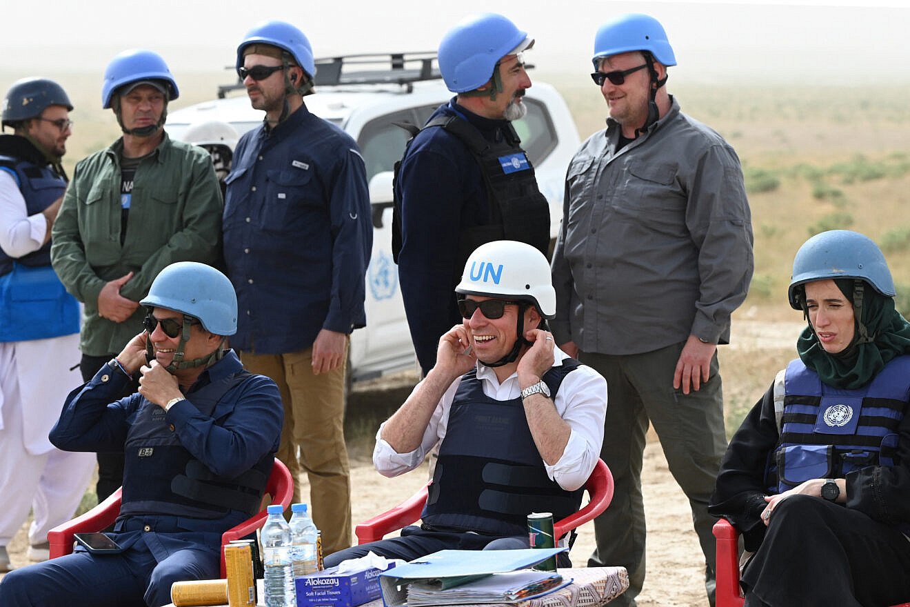 United Nations Under-Secretary-General for Humanitarian Affairs and Emergency Relief Coordinator Tom Fletcher (center) observes as Afghan deminers detonate a mine during a mine clearance demonstration in a field on the outskirts of Chahardara District, Kunduz Province, April 30, 2025. Credit: Wakil Kohsar/AFP via Getty Images.