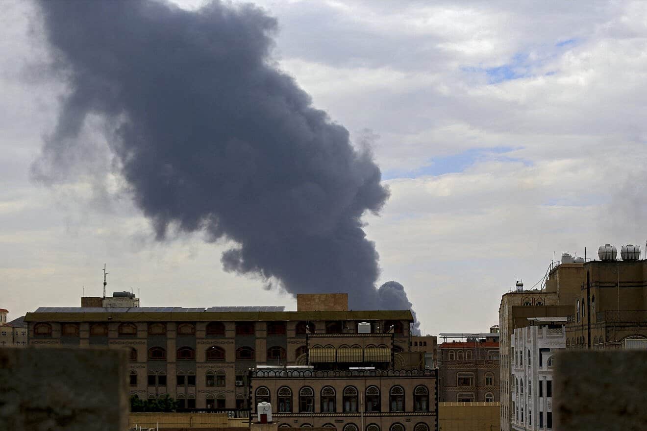 Smoke billows on the horizon following an Israeli air strike on Sanaa, Yemen's Houthi-held capital, on May 6, 2025. Photo by Mohammed Huwais/AFP via Getty Images.