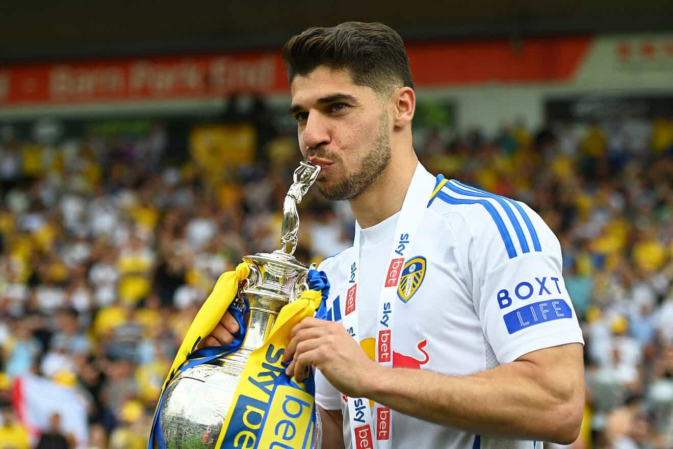 Manor Solomon of Leeds United poses for a photo with the Sky Bet Championship trophy after the team's 2-1 victory over Plymouth Argyle at Home Park in Plymouth, England, on May 3, 2025. Photo by Harry Trump/Getty Images.