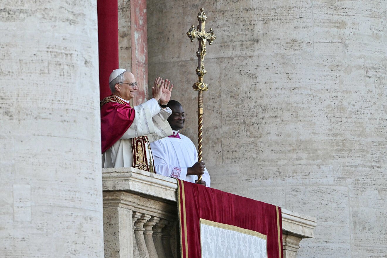 Newly elected Pope Leo XIV, Robert Francis Prevost gestures on the main central loggia balcony of the St Peter's Basilica, after the cardinals ended the conclave, in the Vatican, on May 8, 2025. Credit: Andrej Isakovic/AFP via Getty Images.