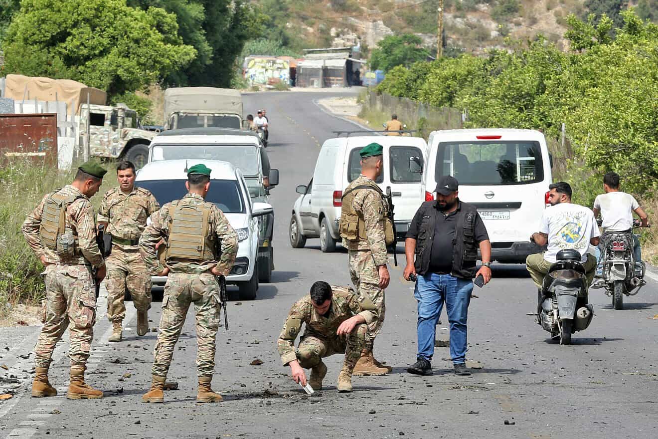 Lebanese Army soldiers inspect a crater following an Israeli drone strike that targeted a car in Abu al-Aswad in Southern Lebanon, May 17, 2025. Photo by Mahmoud Zayyat/AFP via Getty Images.