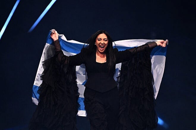 Yuval Raphael, representing Israel with the song "New Day Will Rise," parades during the flag ceremony before the Grand Final of the Eurovision Song Contest 2025, at the St. Jakobshalle arena in Basel on May 17, 2025. Photo by Fabrice Coffrini/AFP via Getty Images.