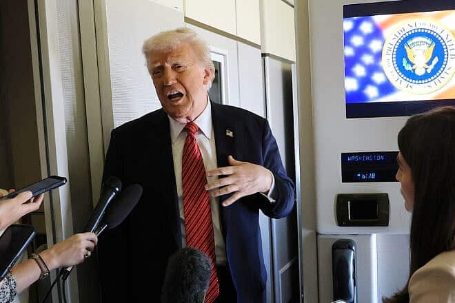 U.S. President Donald Trump speaks to media aboard Air Force One on a range of issues, including Syria, as he flies to Doha, Qatar, on May 14, 2025. Photo by Win McNamee/Getty Images.