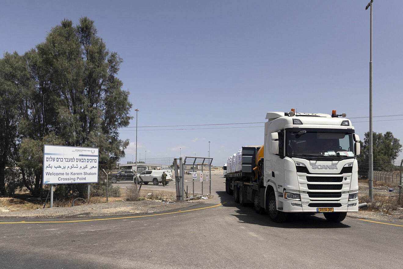 A humanitarian aid truck moves on the Israeli side of the Kerem Shalom Crossing Point on May 19, 2025 in southern Israel. Photo by Amir Levy/Getty Images.