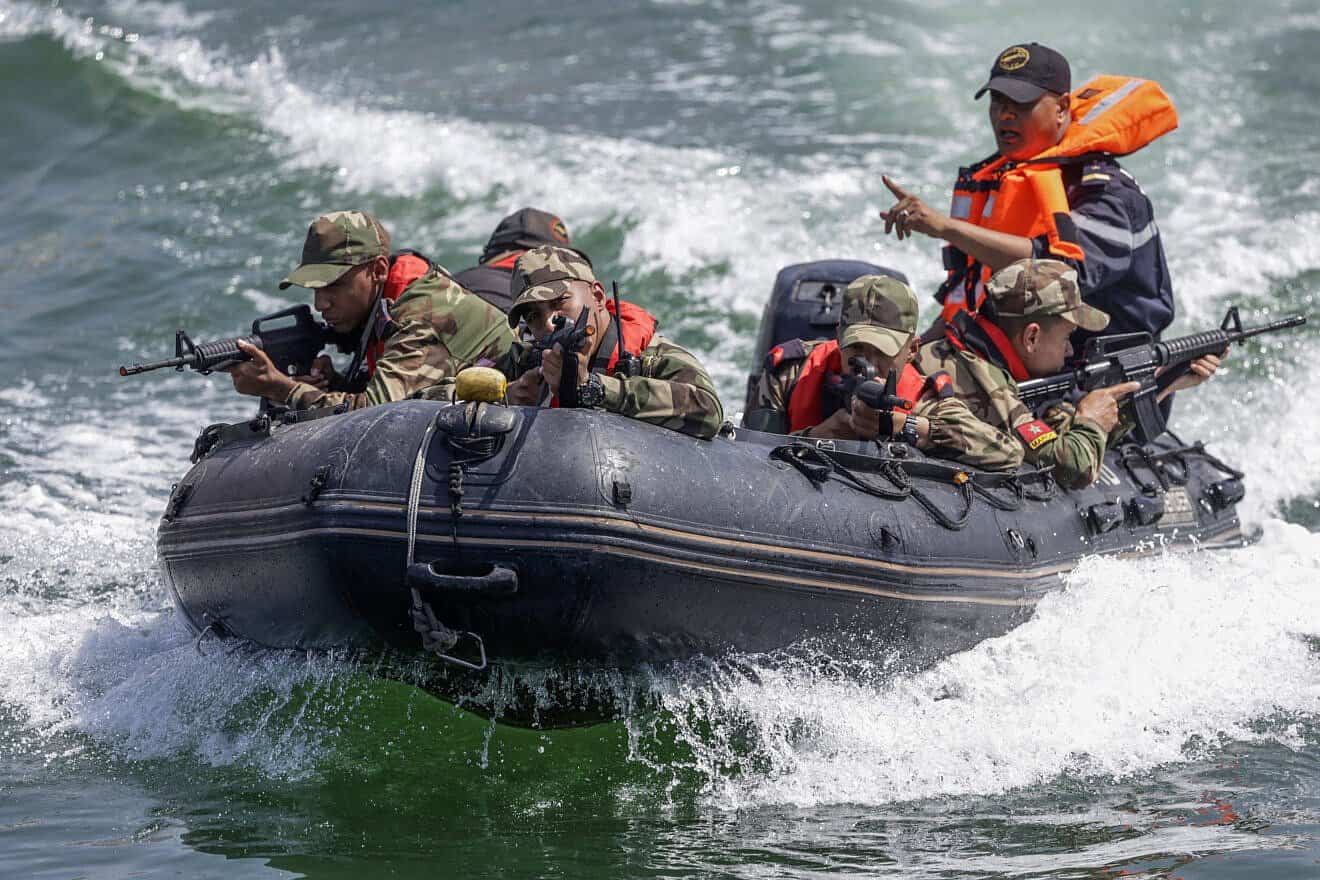 Moroccan soldiers simulate securing a port during the multinational African Lion war games in Agadir, May 20, 2025. Photo by Abdel Majid Bziouat/AFP.