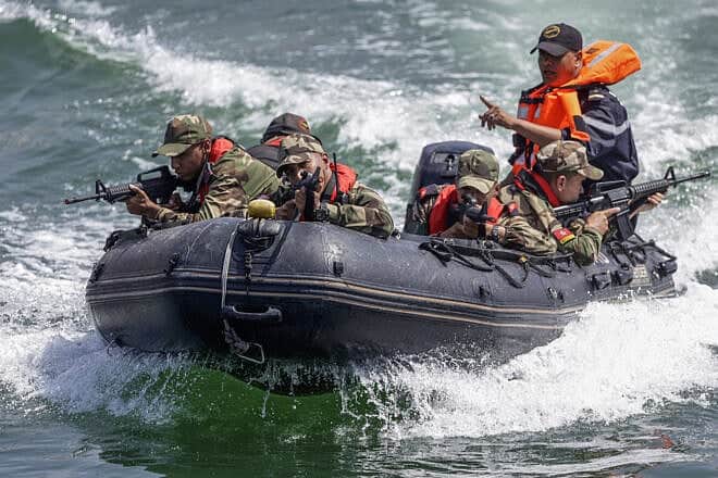 Moroccan soldiers simulate securing a port during the multinational African Lion war games in Agadir, May 20, 2025. Photo by Abdel Majid Bziouat/AFP.
