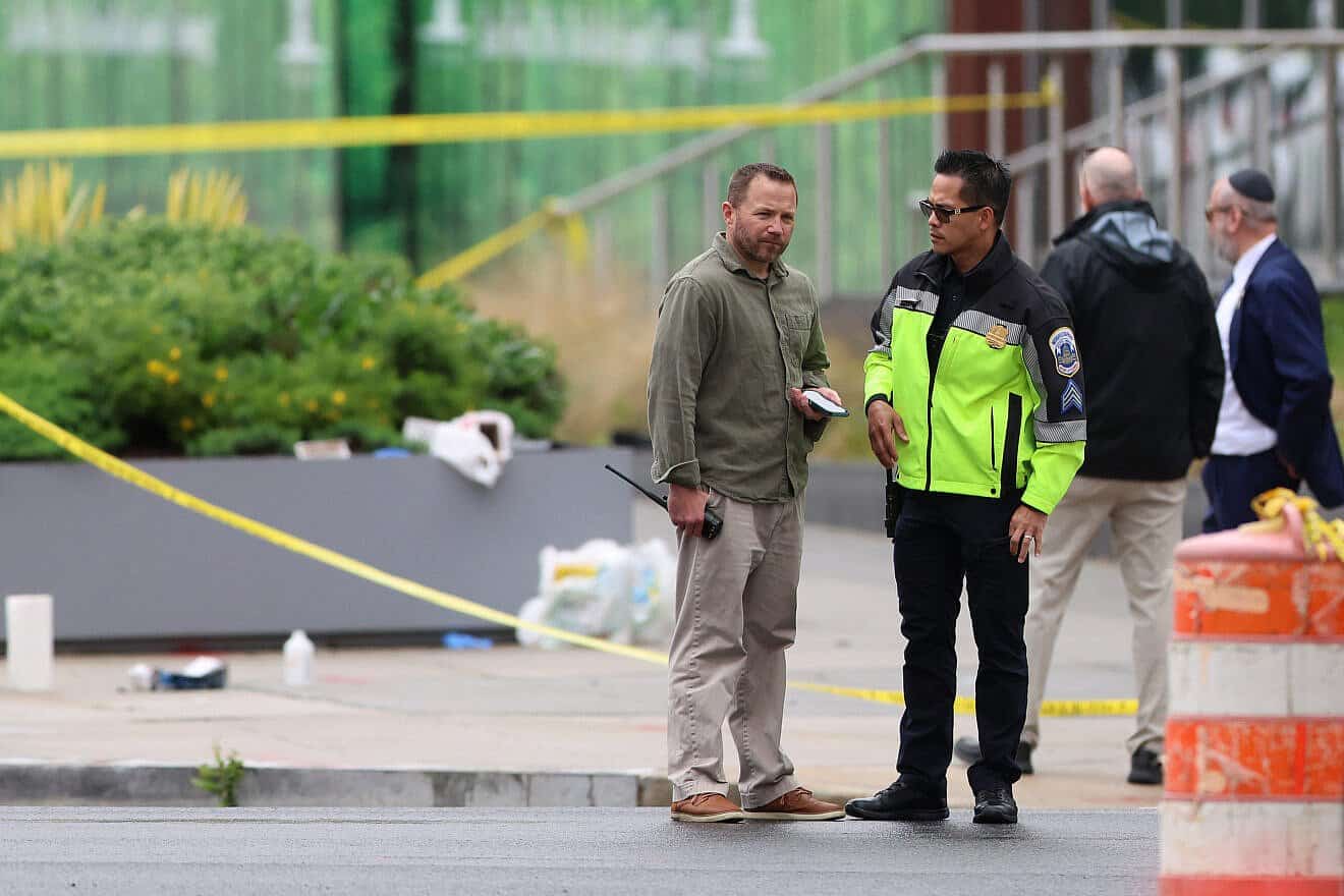 Law enforcement officers stand by near the shooting site outside the Lillian and Albert Small Capital Jewish Museum on May 22, 2025 in Washington, D.C. Two Israeli Embassy staff members, Yaron Lischinsky and Sarah Lynn Milgrim, were gunned down Wednesday evening after an event at the museum by a man shouting slogans in support for Palestine. Photo by Tasos Katopodis/Getty Images.